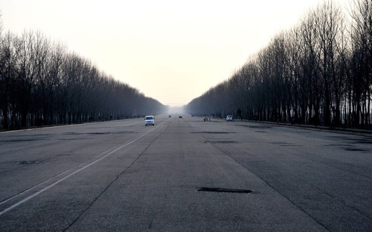 An eight-lane super highway in North Korea is almost devoid of traffic in this image taken by Swedish photographer Björn Bergman. The road - which stretches around 160km from capital Pyongyang to the border with South Korea - is also in a state of disrepair.